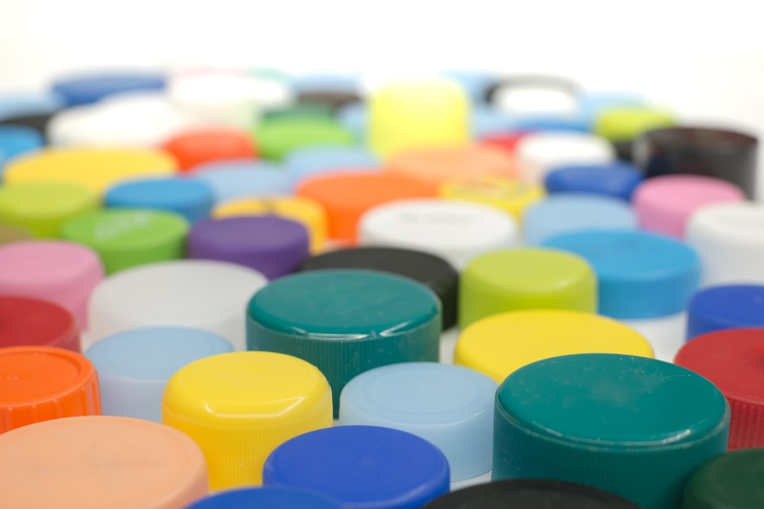 Assorted plastic bottle lids and caps in a pile