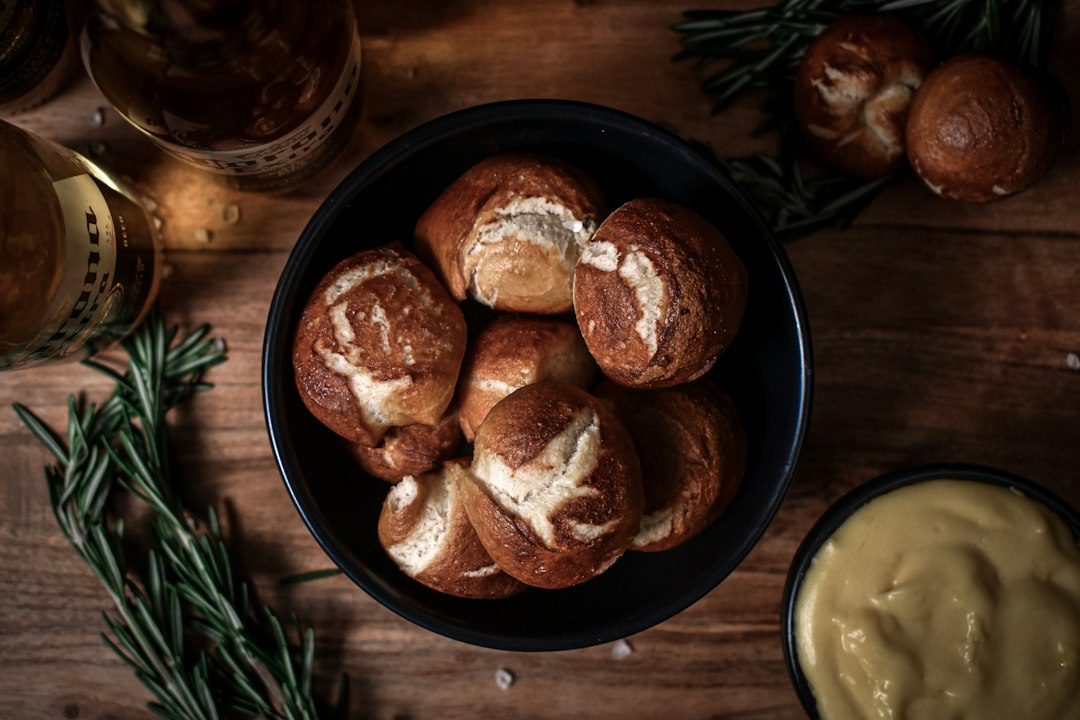 Soft pretzel bites served with mustard and cold beer