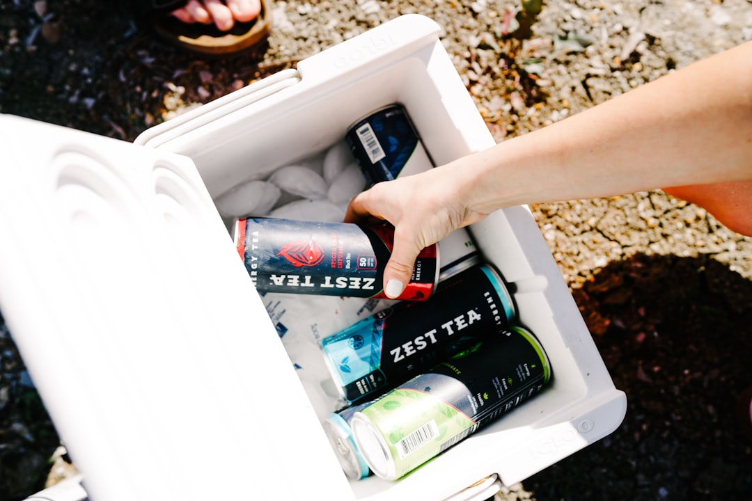 Cooler filled with ice and canned drinks
