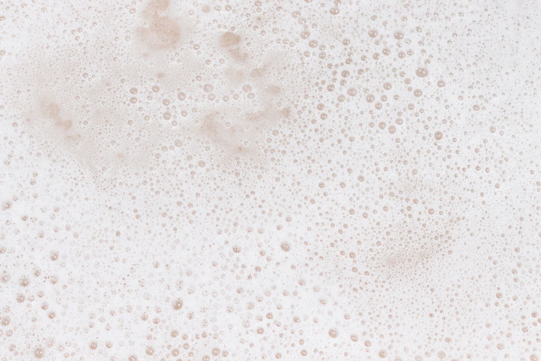 Soap suds building in the sink during mid-cook dish washing