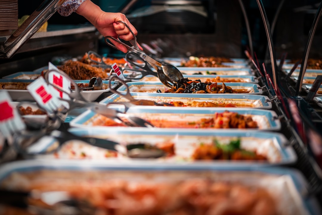 Guests serving food from a buffet line