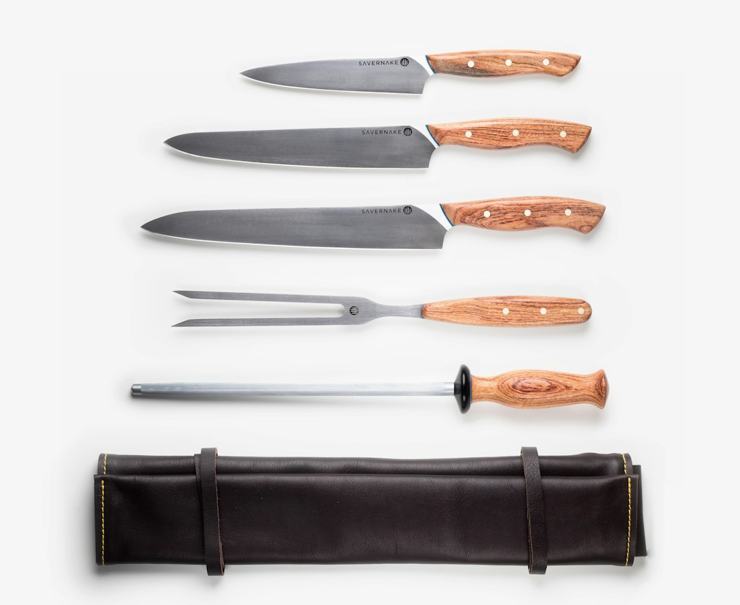 Chef's knife against a honing steel rod