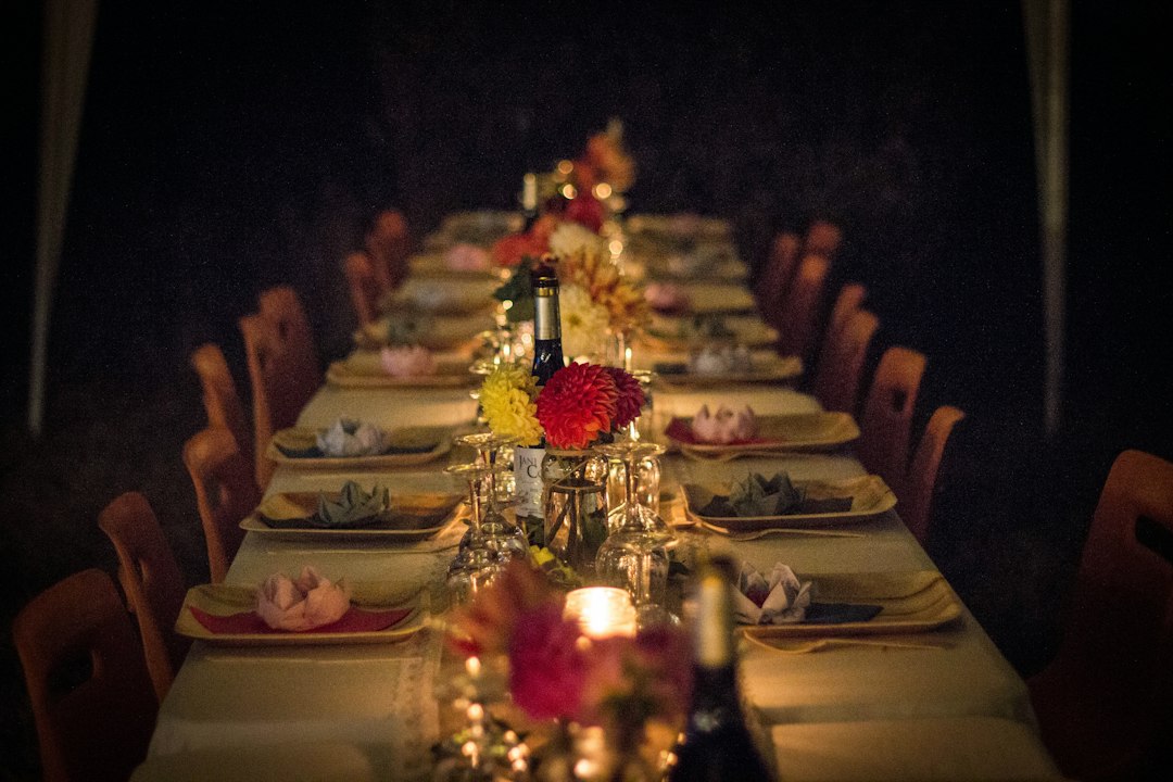 Candlelit dinner table set for a gathering