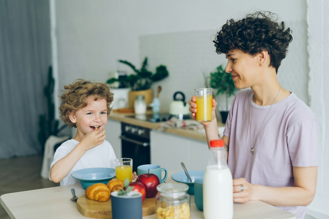 Family gathering around a breakfast table in the morning