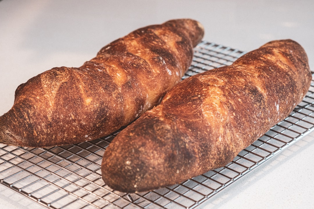 Fresh baked bread loaves cooling on a rack