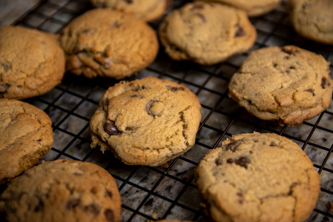 Chocolate chip cookies cooling on a wire rack