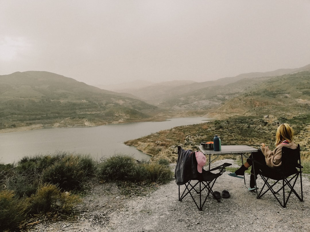 Folding camp table set up with chairs outdoors