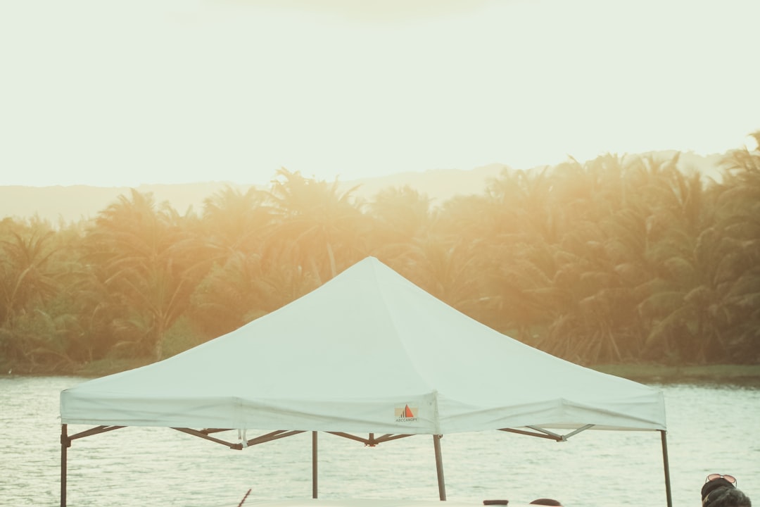 Pop-up canopy tent providing shade outdoors