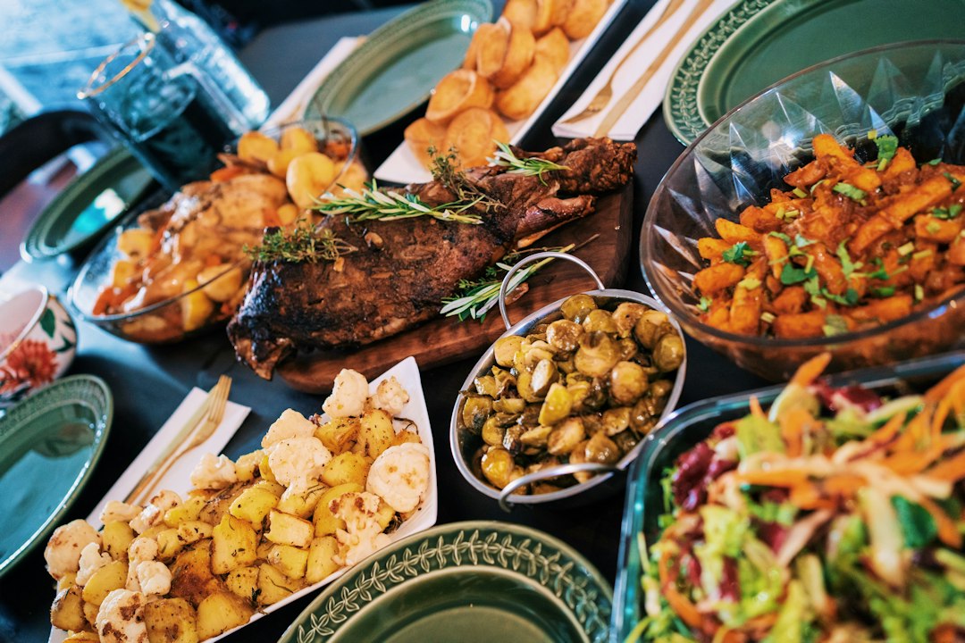 An abundant party table with plates everywhere — the whole point
