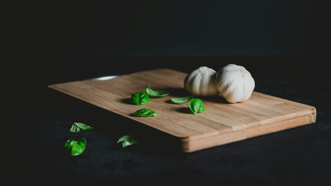 Garlic and basil on a wooden board
