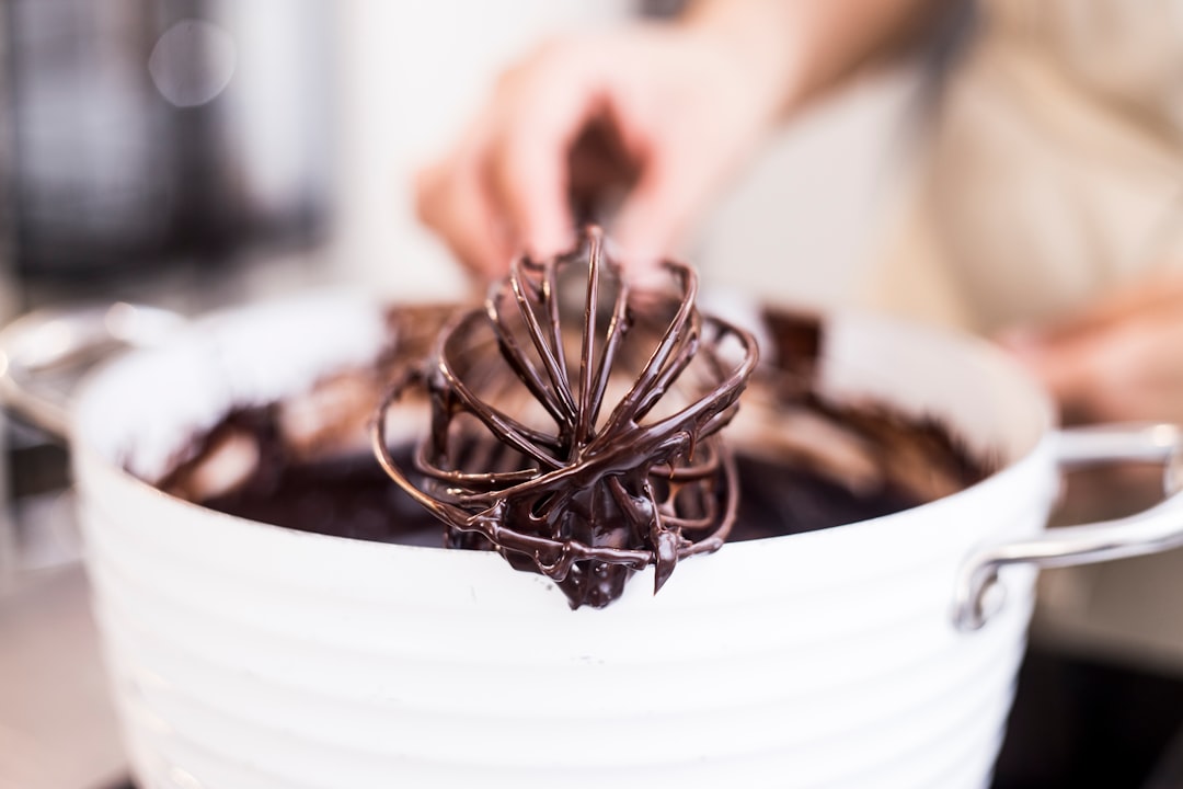 A pot of glossy melted chocolate ready for the dessert course