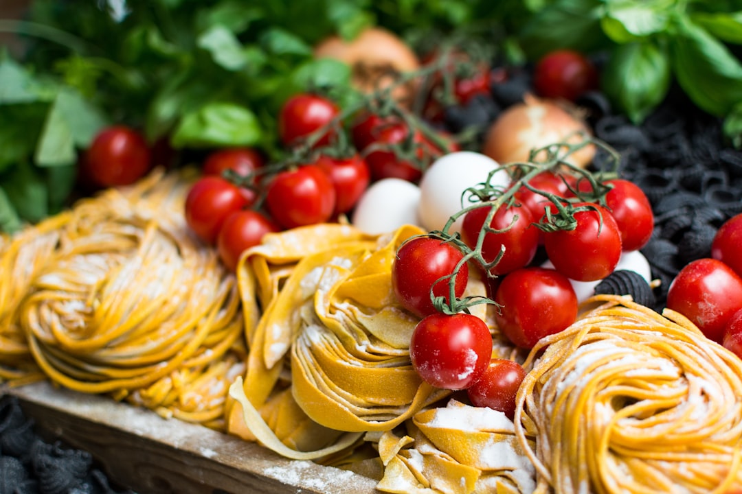 Nests of fresh pasta drying on a tray