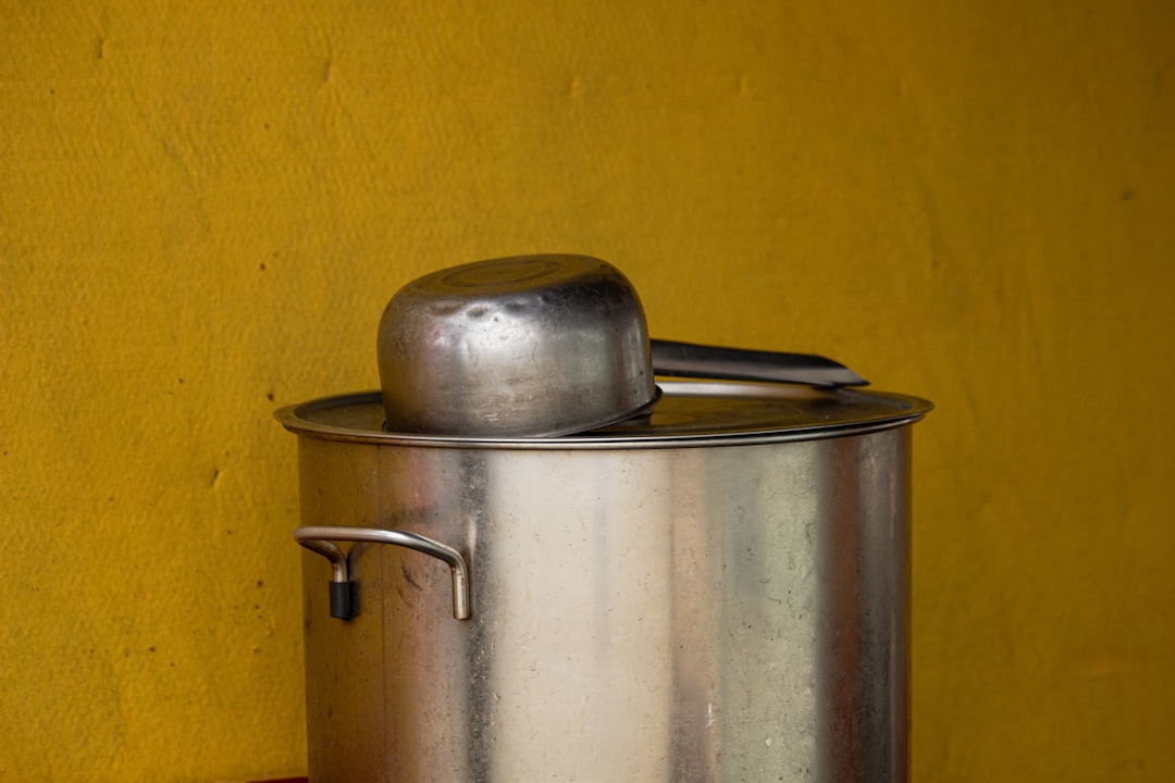 Large stainless steel stock pot on a kitchen counter