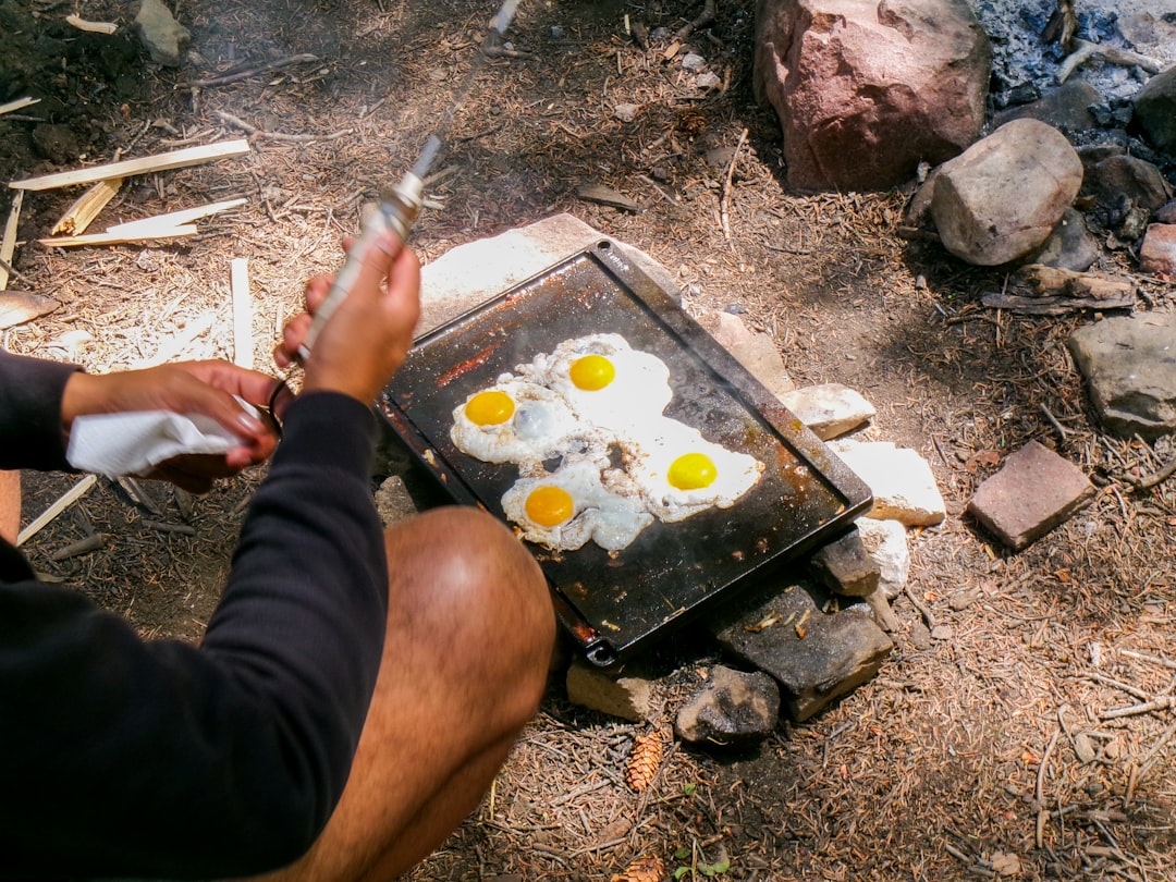 Cooking breakfast on a portable outdoor griddle