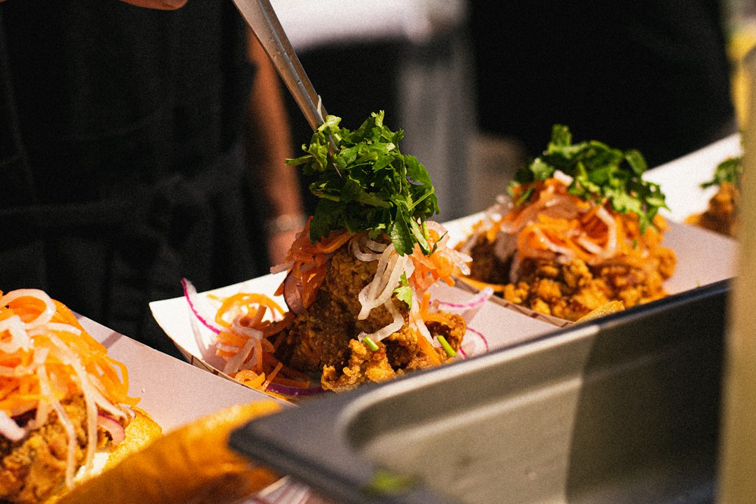 Taco night spread with chicken tacos in paper trays