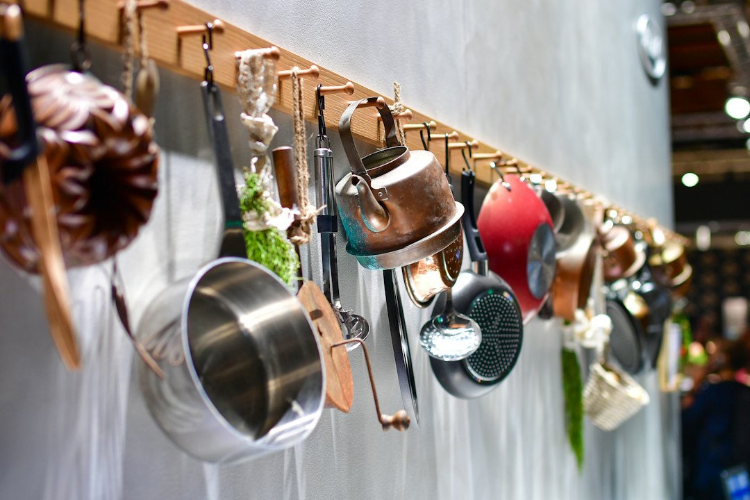 Copper pots hanging neatly above a kitchen work area