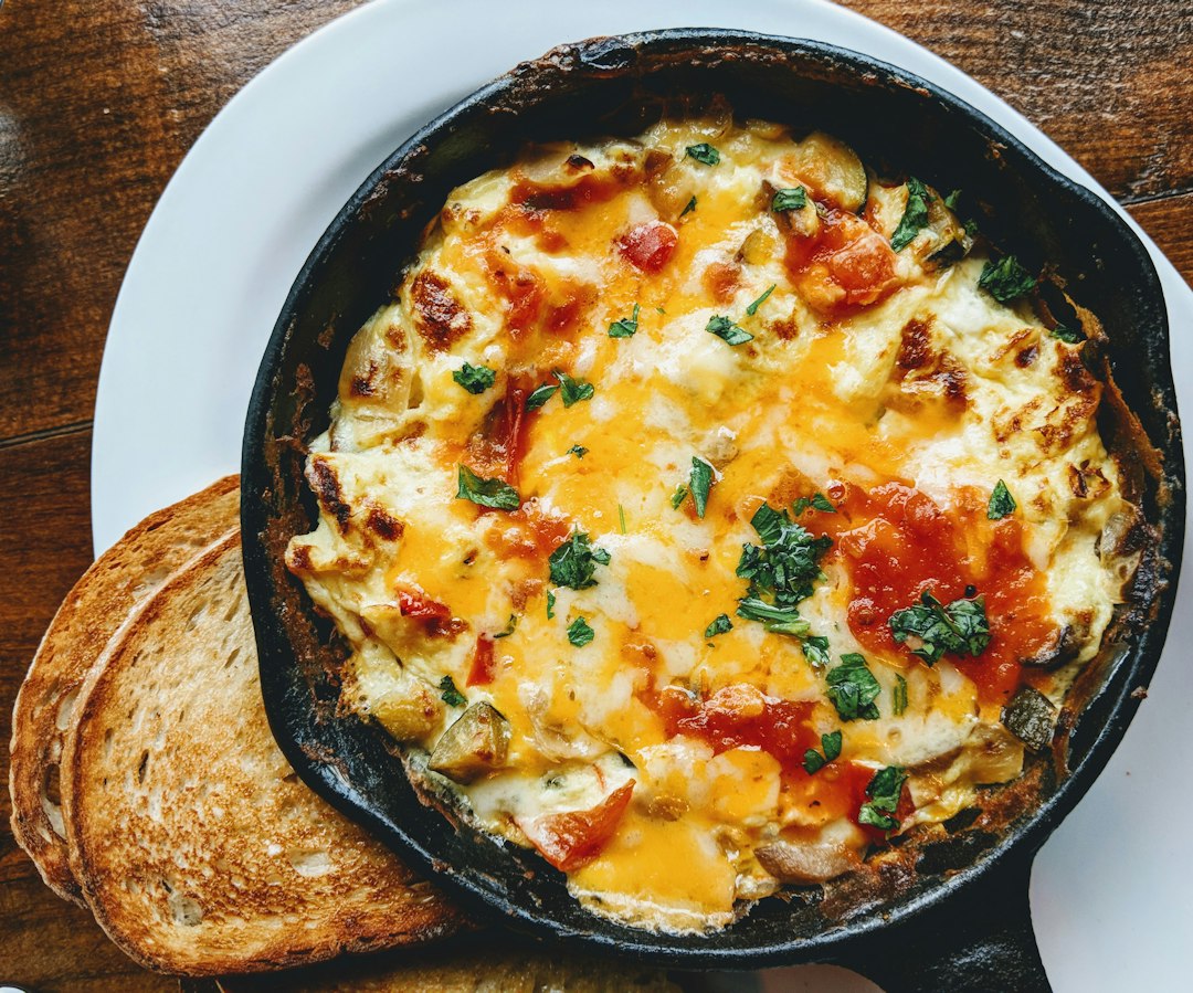 Soft scrambled eggs in a pan on the stove