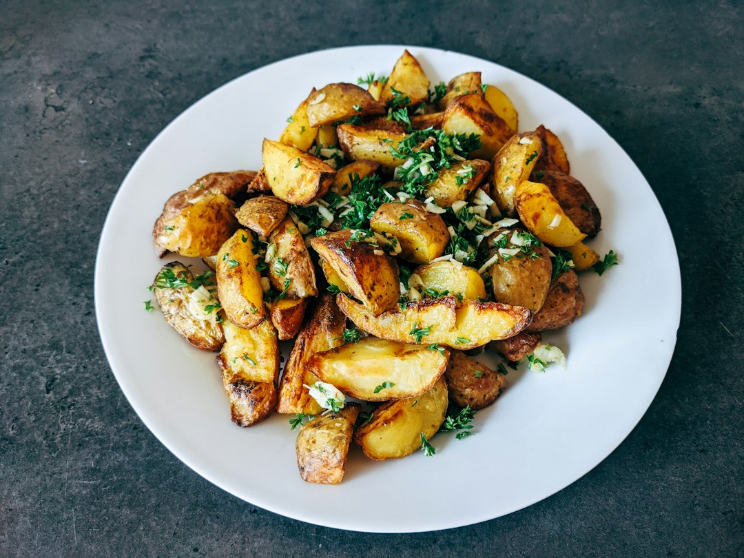 Roasted potato wedges with herbs, the texture a ricer is not trying to make