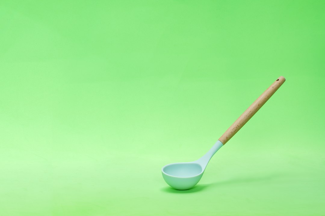 A ladle ready at the stove for serving