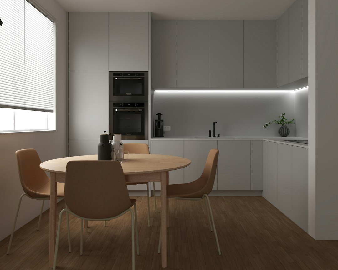 Compact apartment kitchen with dining nook and limited counter space