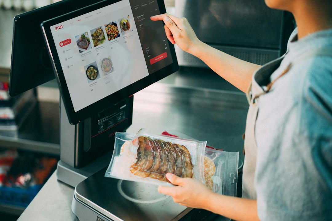 A commercial kitchen sealing packages of food with a chamber vacuum machine