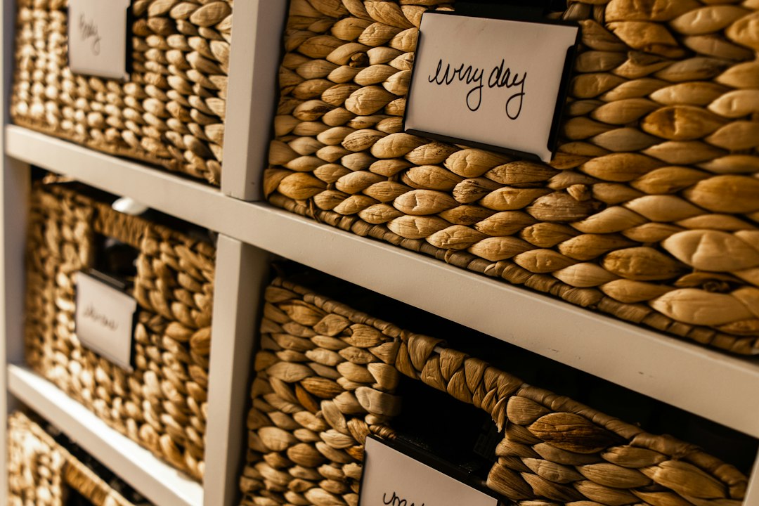 Labeled woven storage baskets arranged for kitchen decluttering