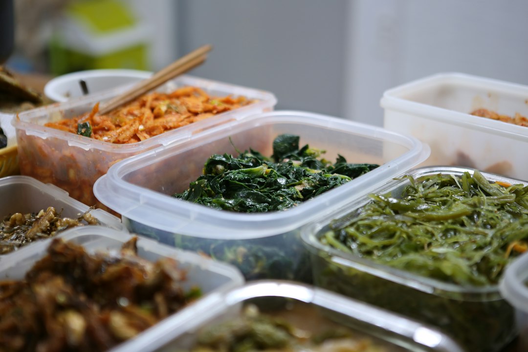 Identical clear quarts, packed shallow, stacked straight — the restaurant trick that tames Thursday’s volume.