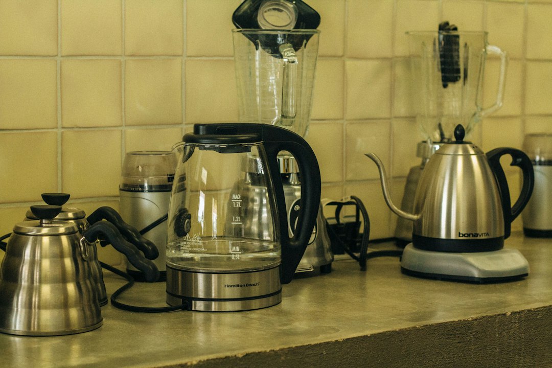 Electric kettles lined up on a kitchen counter