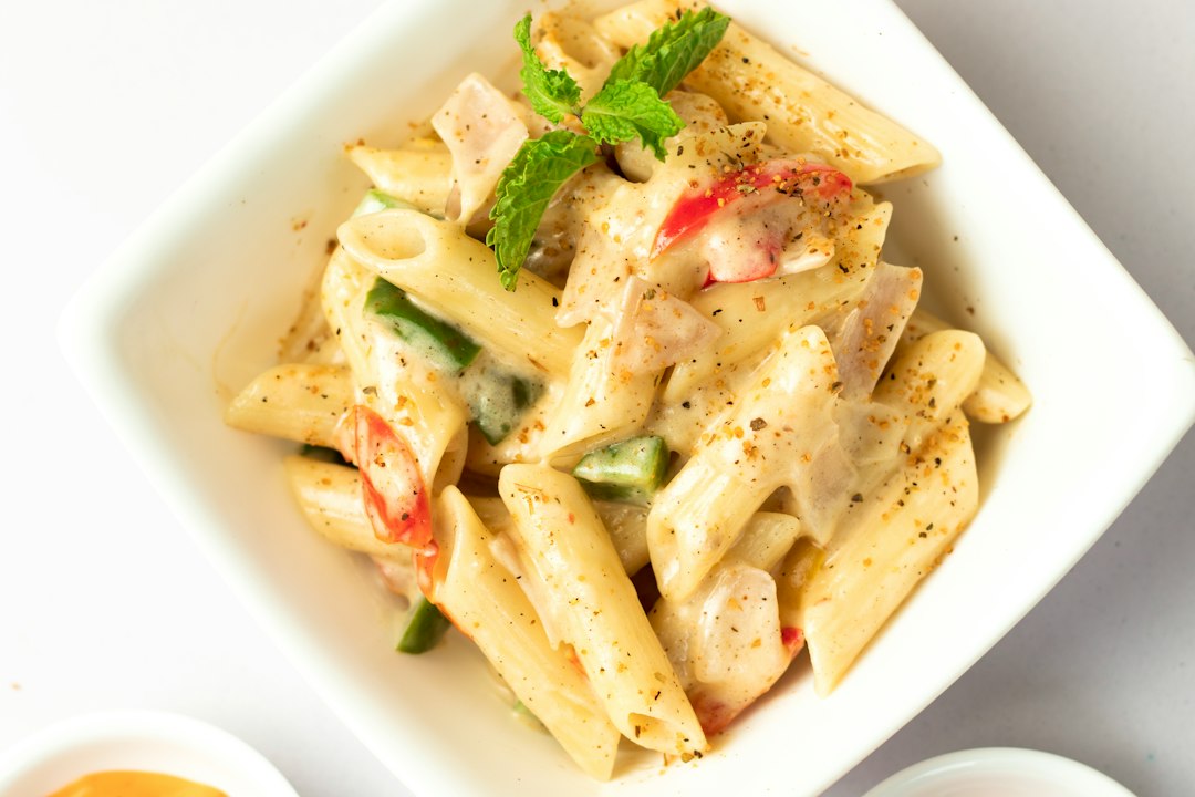 Creamy penne pasta finished with cracked black pepper