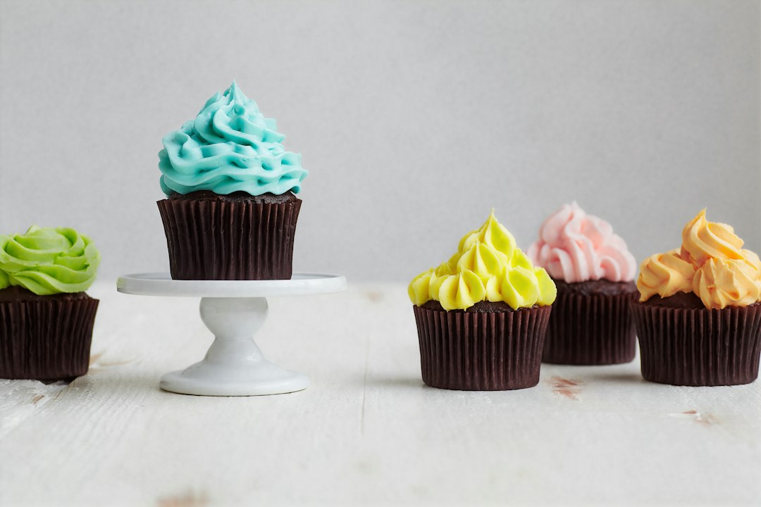 cupcakes topped with colorful piped buttercream frosting