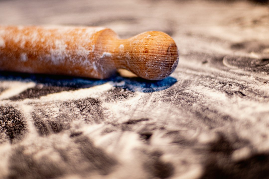 Marble rolling pin with dough on a pastry board
